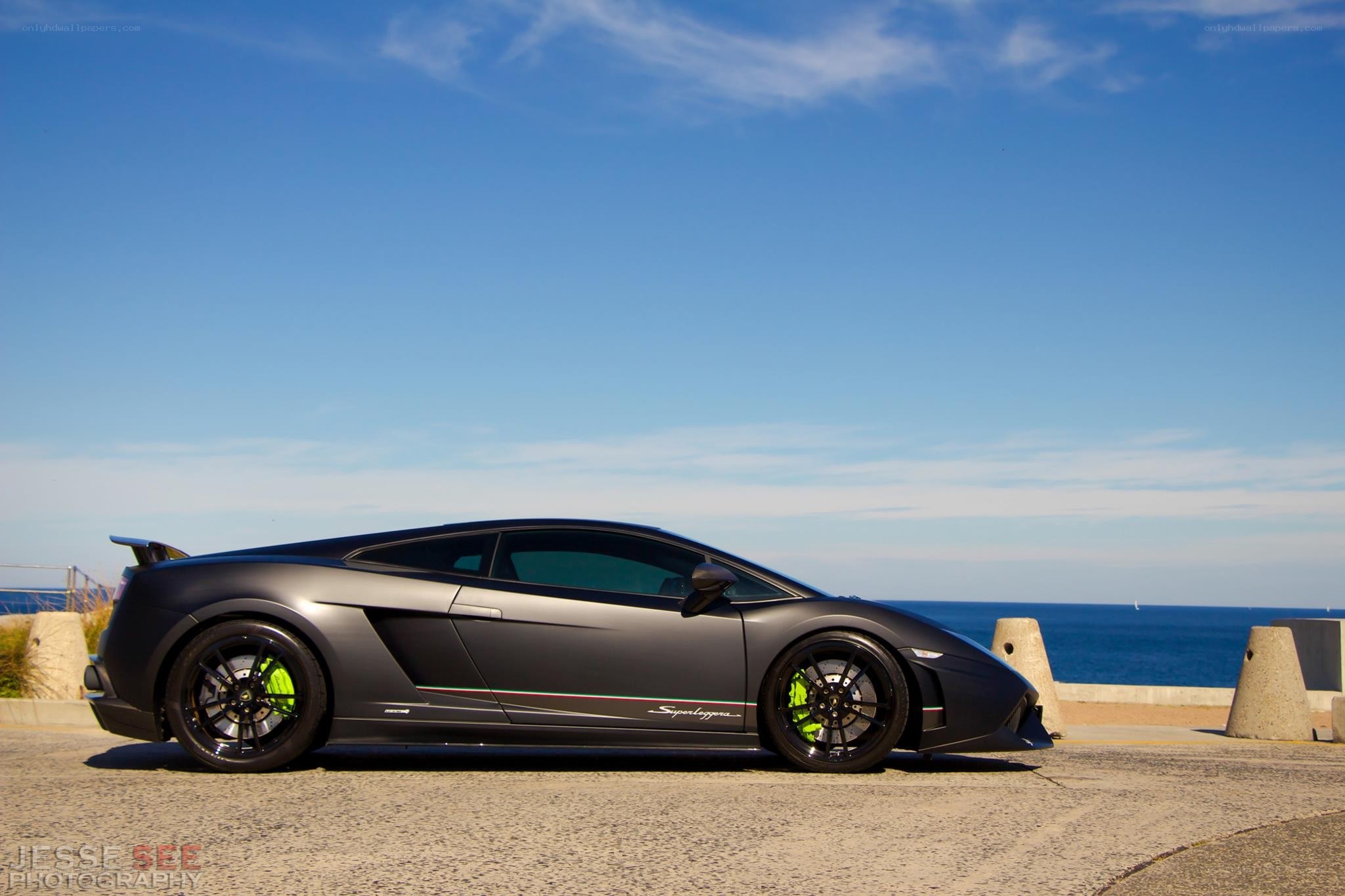 Matte black Lamborghini on the coast