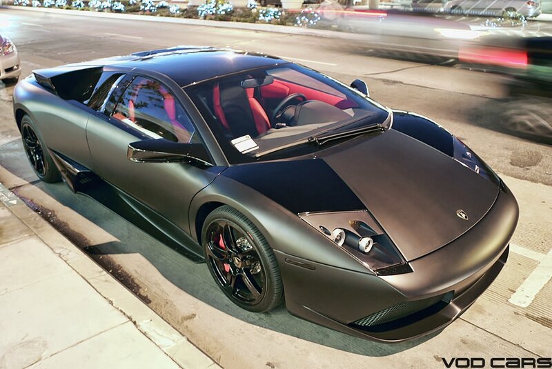 Matte black Lamborghini parked on street