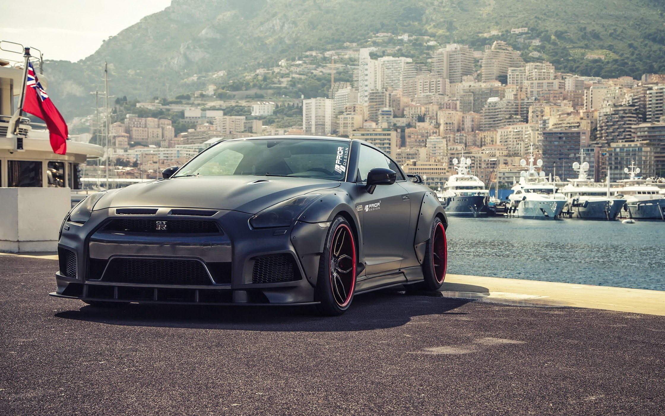 Matte black Nissan GT-R by the harbor