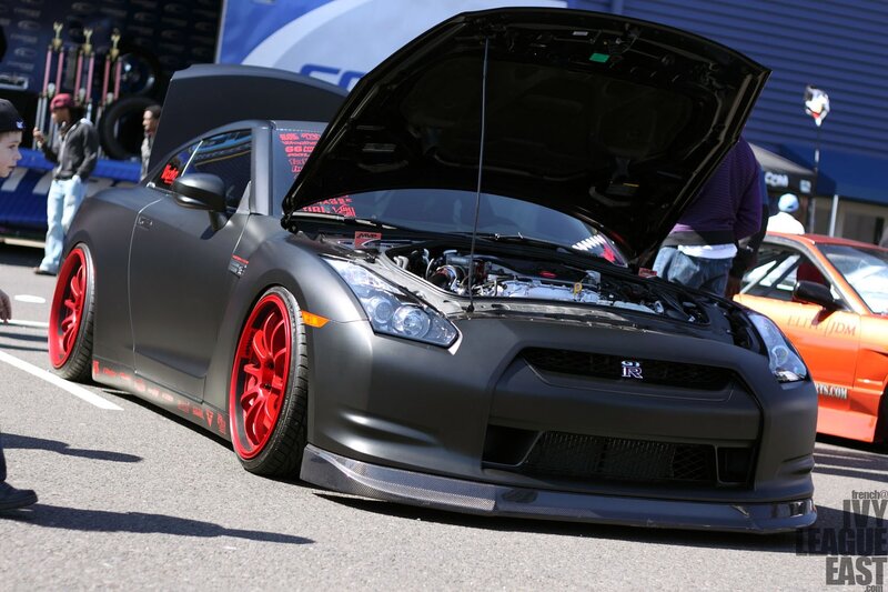 Matte black Nissan GT-R with red wheels