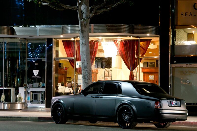 Matte black Rolls-Royce on city street