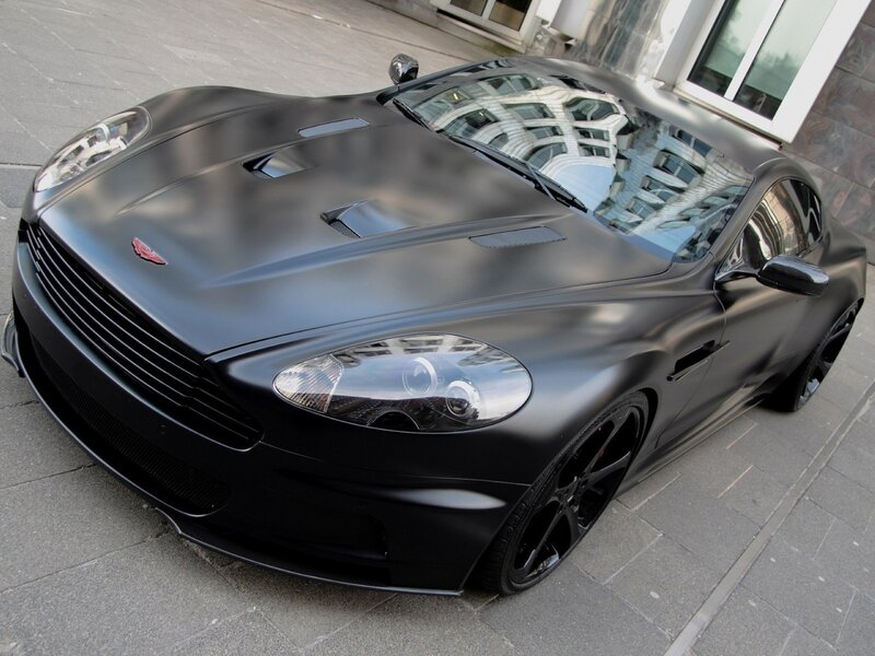 Matte Black Sports Car — Calm, Afternoon, Photograph, Building, Pavement, Gray