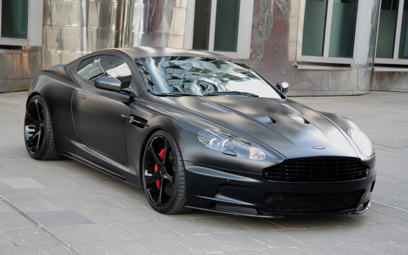 Matte Black Sports Car — Calm, Afternoon, Photograph, Building, Windows, Pavement, Gray