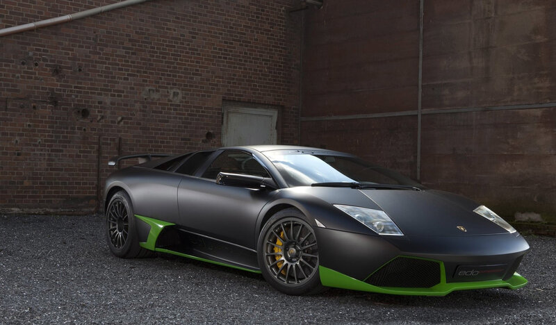 Matte Black Sports Car — Dramatic, Photograph, Brick Wall