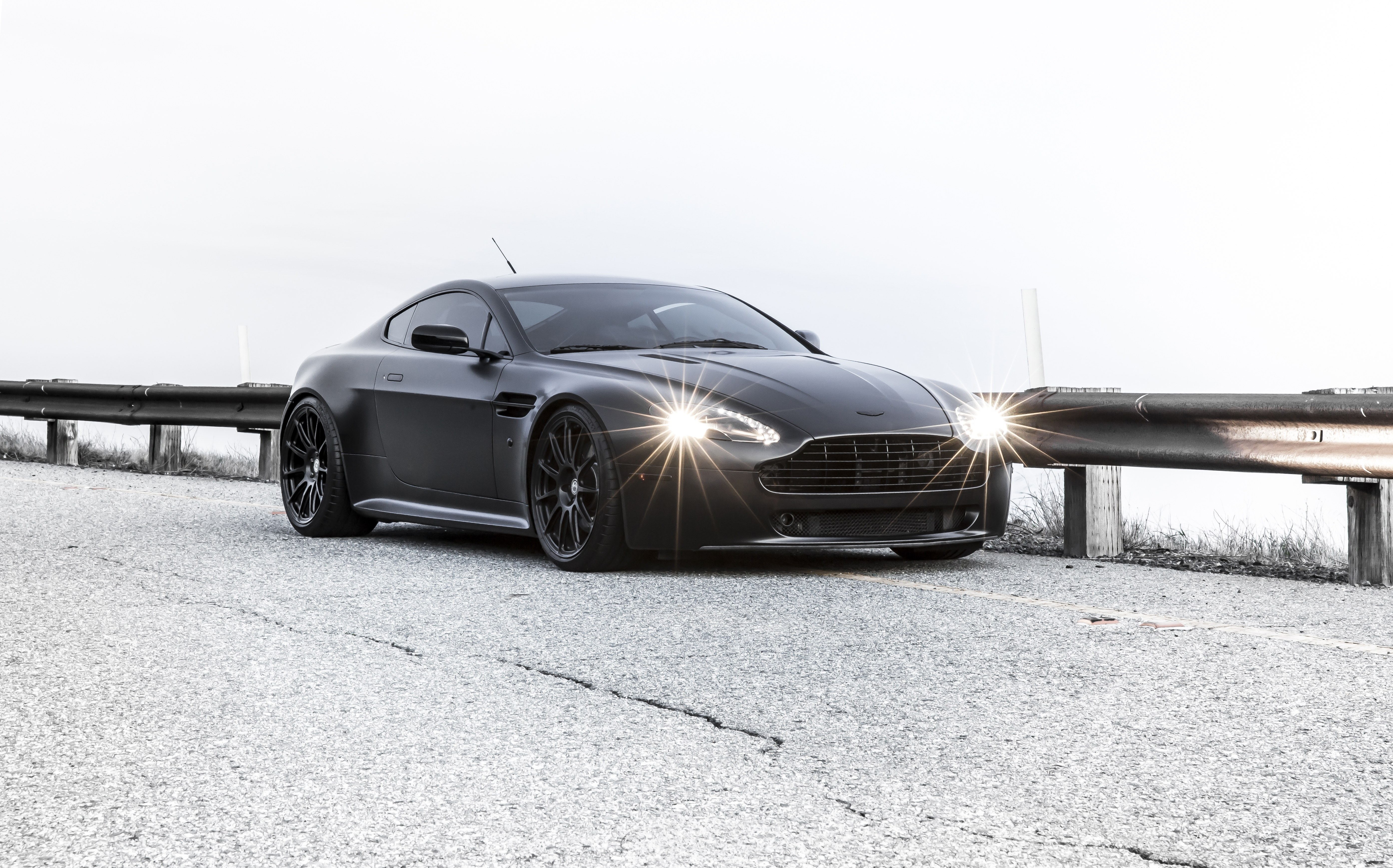 Matte black sports car on road