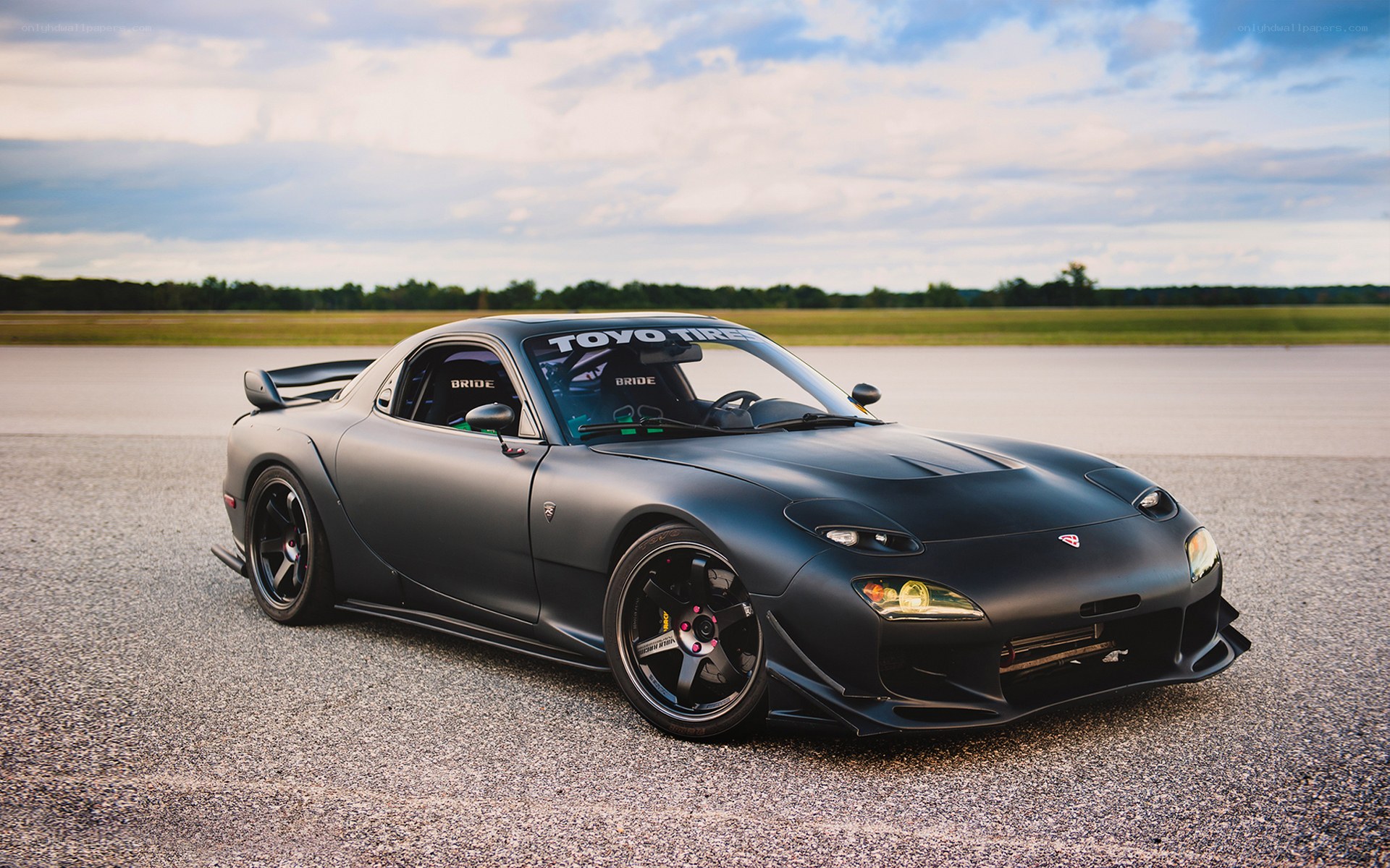 Matte black sports car on track