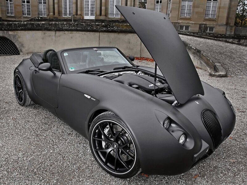 Matte black sports car with open hood