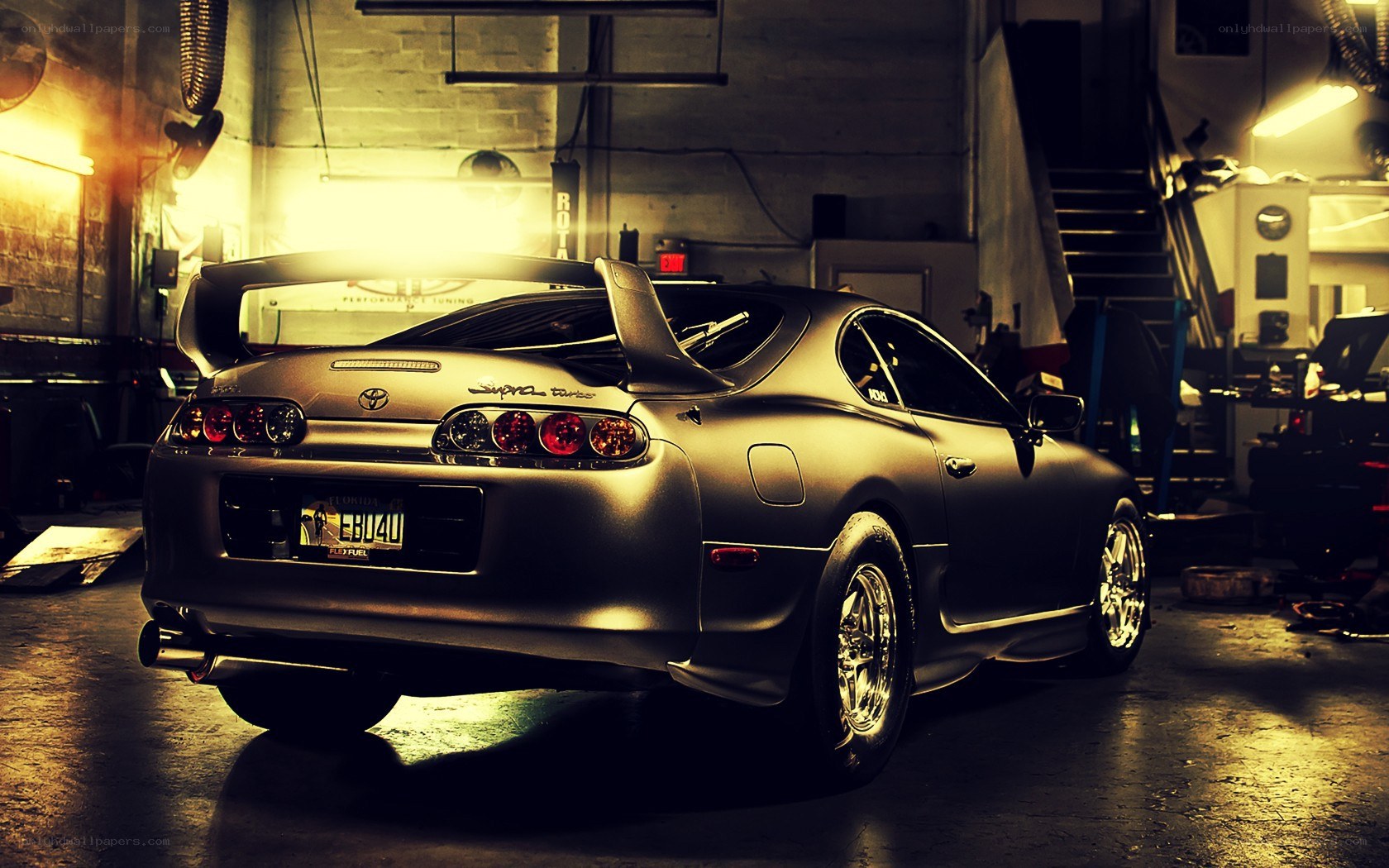 Matte black Supra in garage