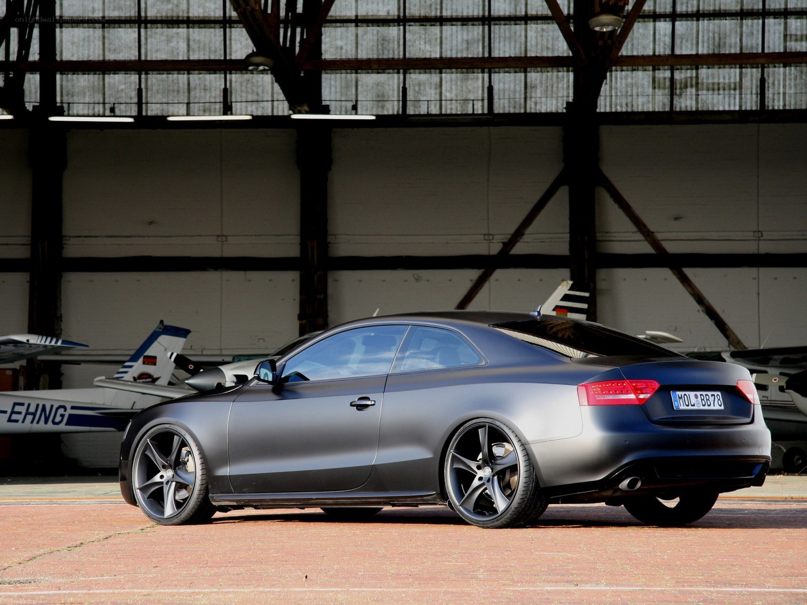 Matte gray Audi in hangar