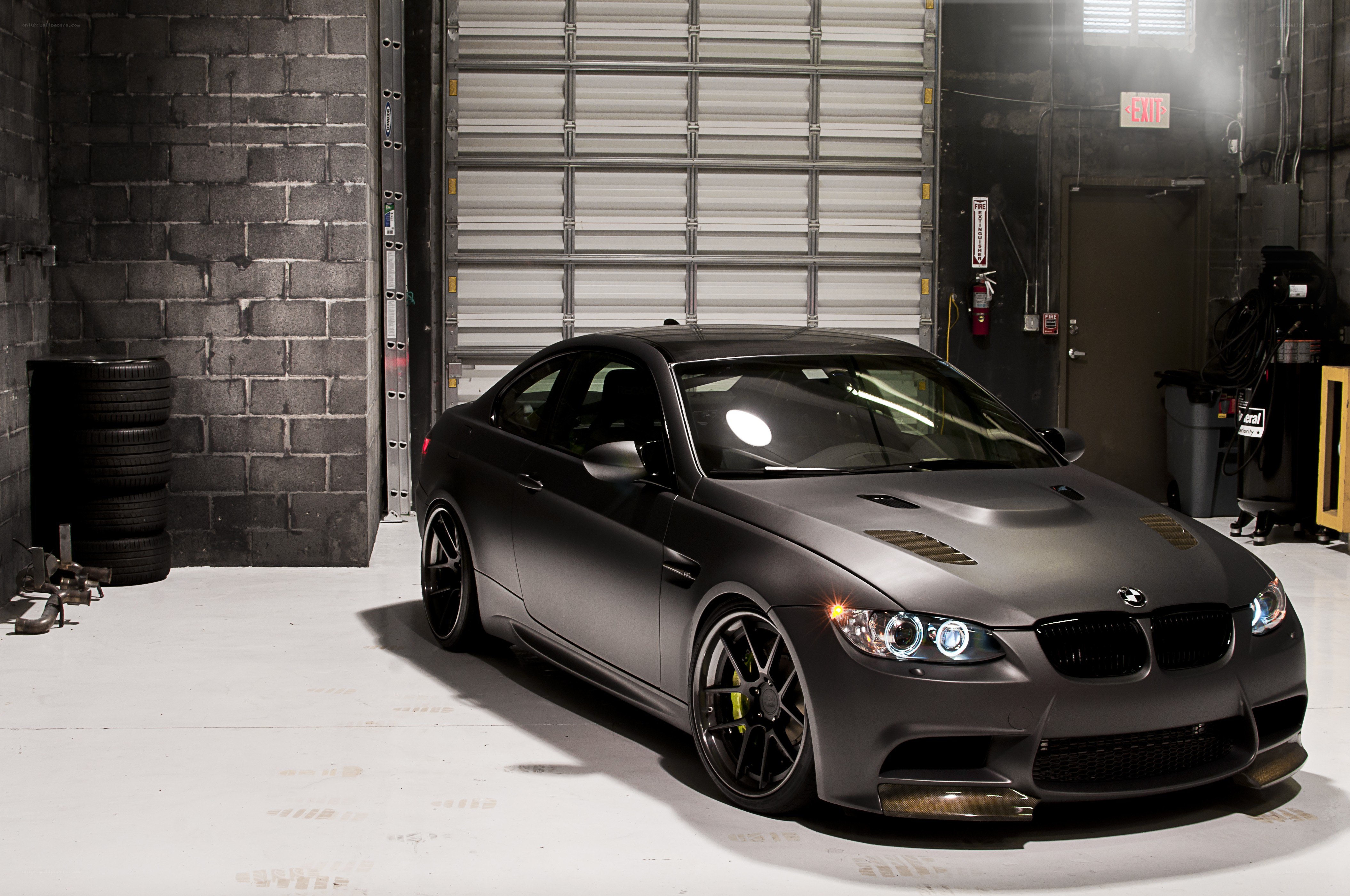 Matte gray BMW M3 in garage