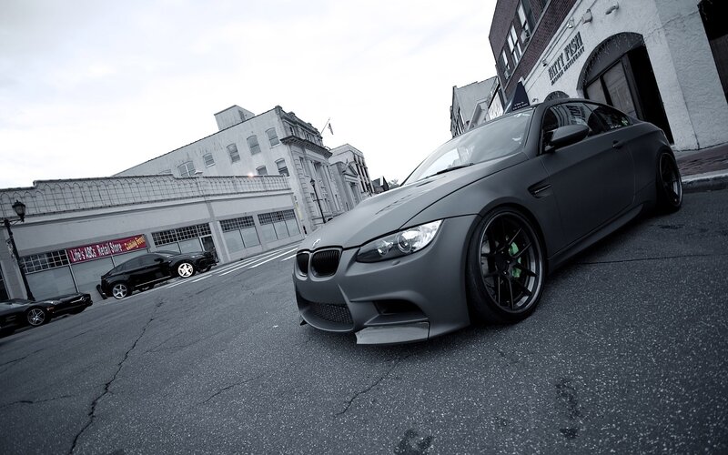 matte gray bmw m3 on city street