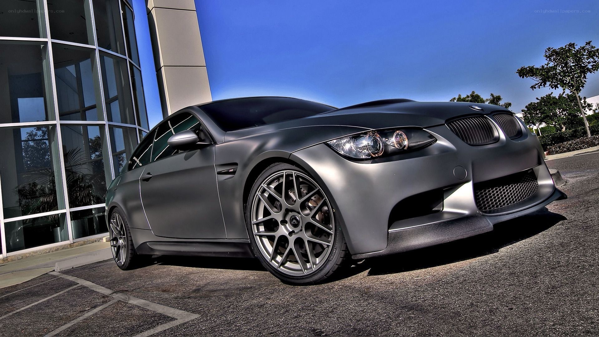 Matte gray BMW M3 parked outside