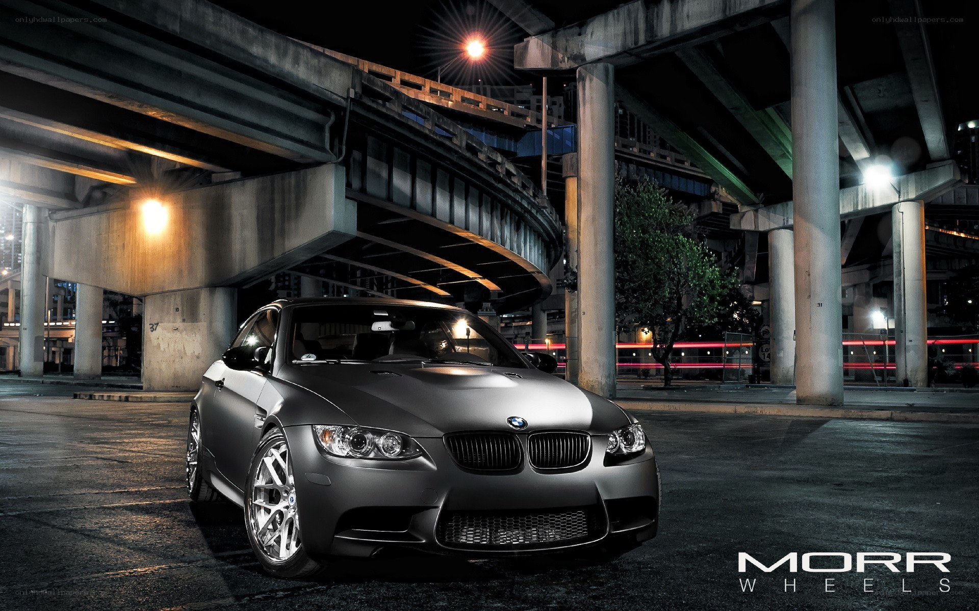matte gray bmw under highway
