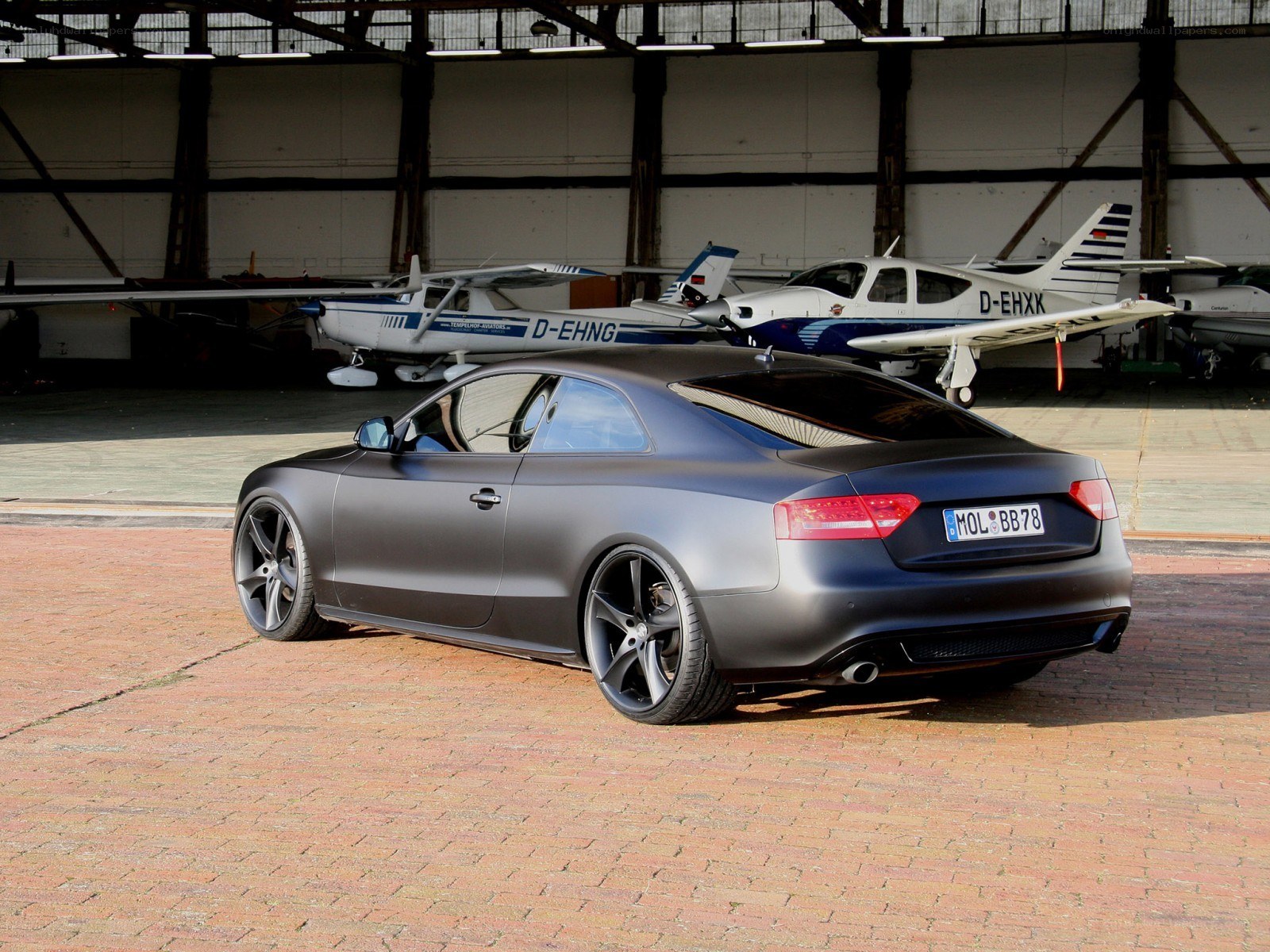 Matte gray coupe in hangar