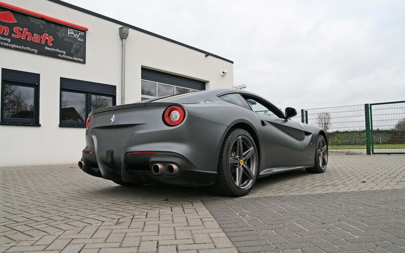 Matte gray Ferrari F12 parked outside