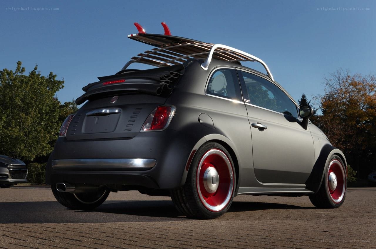 Matte gray Fiat with surfboard rack