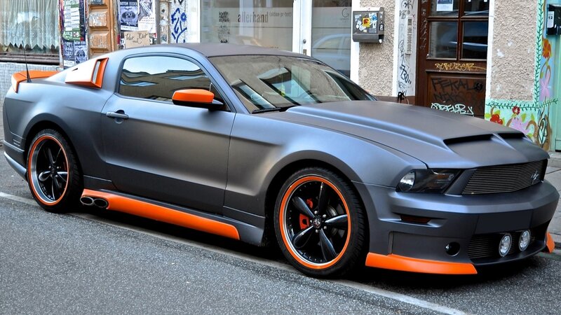 Matte gray Ford Mustang with orange accents