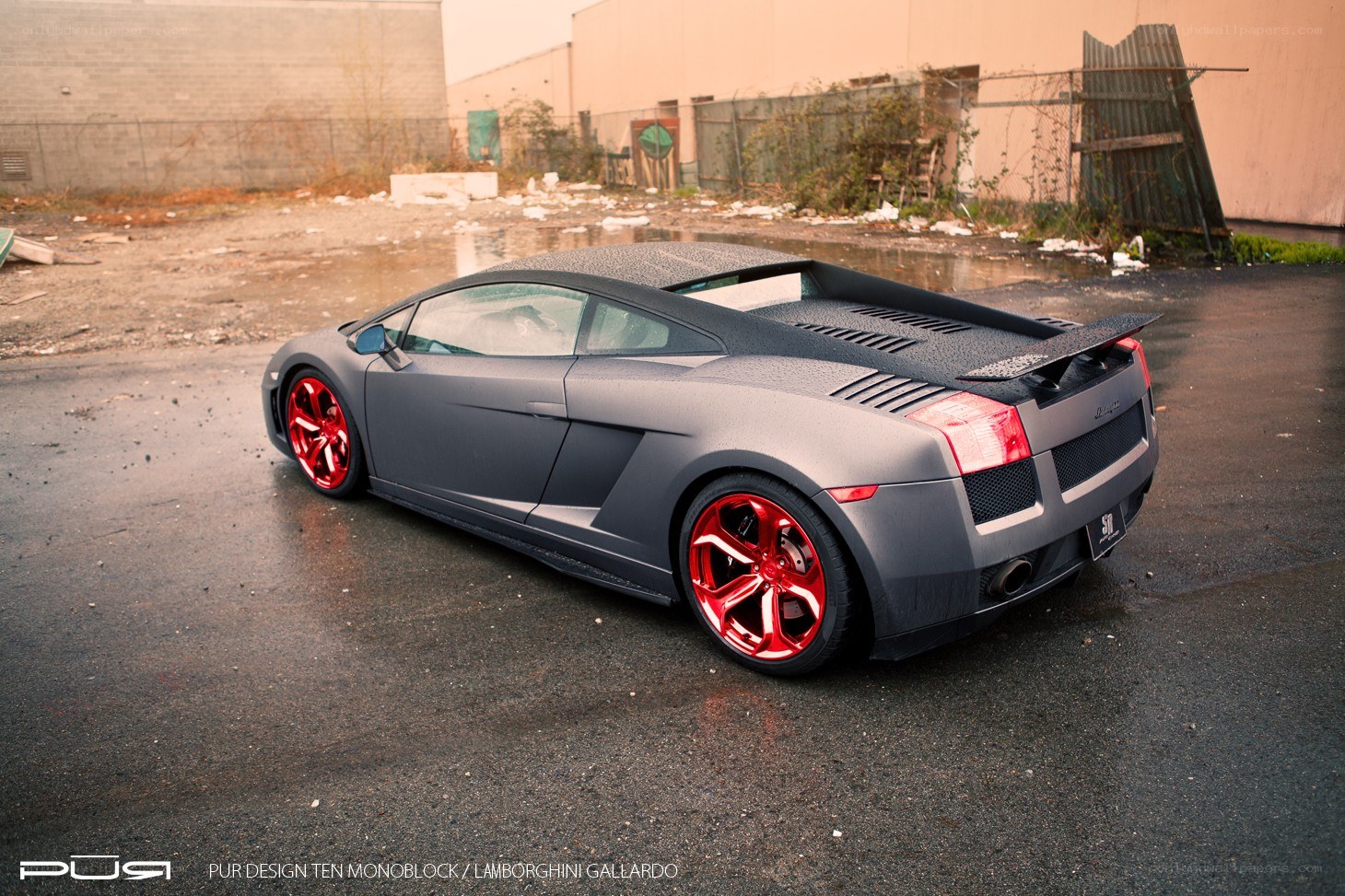 Matte gray Lamborghini with red wheels