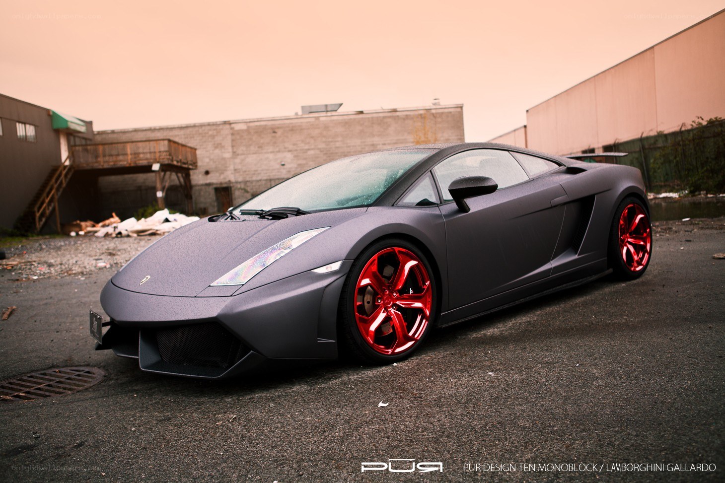 Matte gray Lamborghini with red wheels