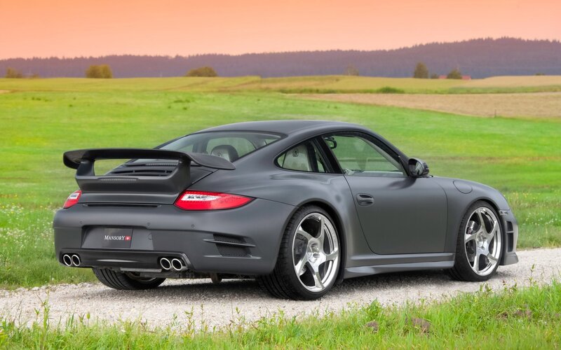 Matte gray Porsche in a field