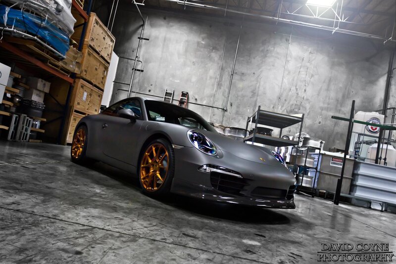 Matte gray Porsche in warehouse