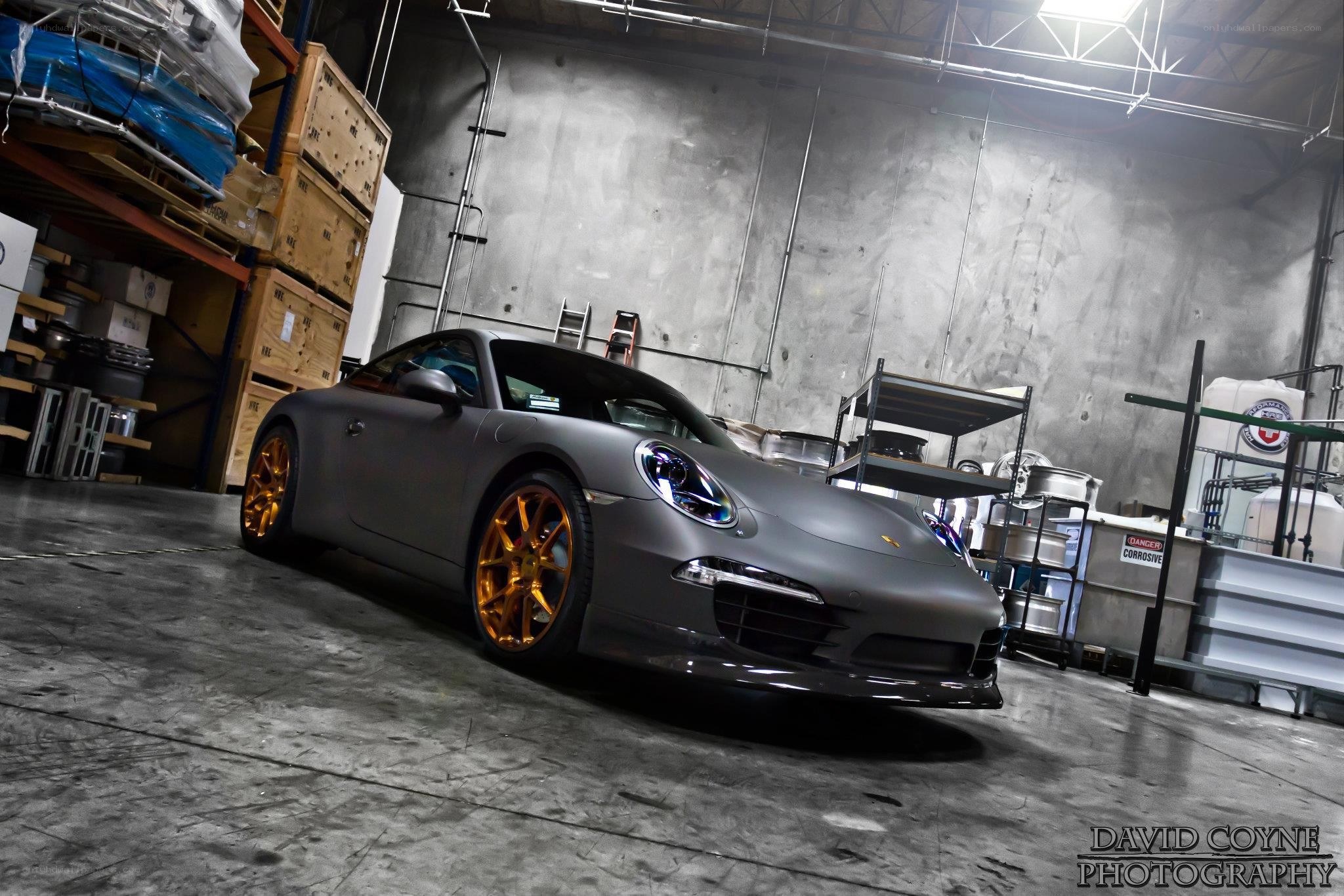 Matte gray Porsche in warehouse