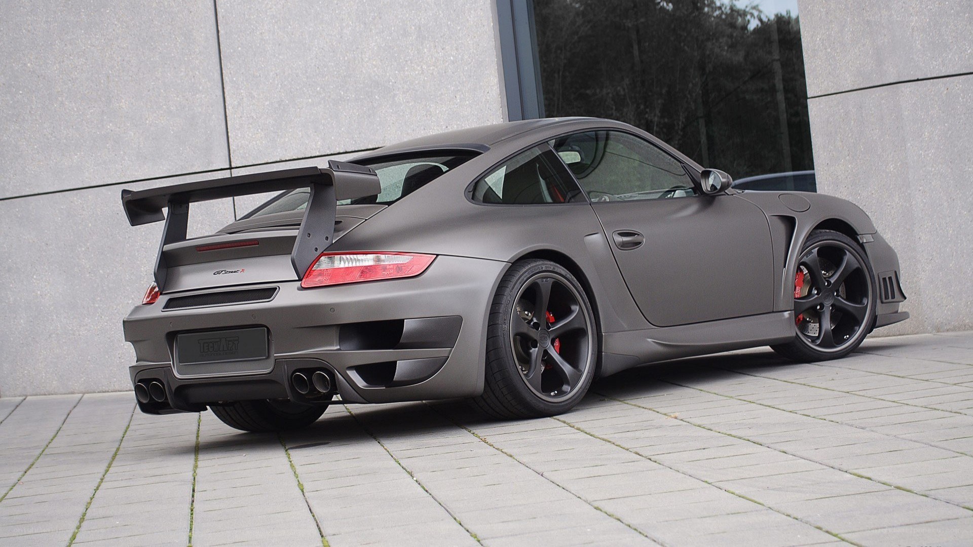 matte gray porsche with rear wing