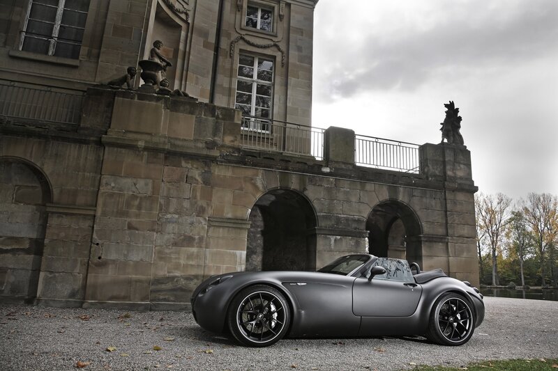 Matte gray sports car at a historic estate