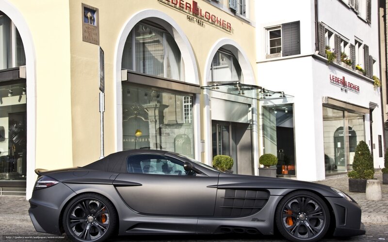 Matte gray sports car in front of store