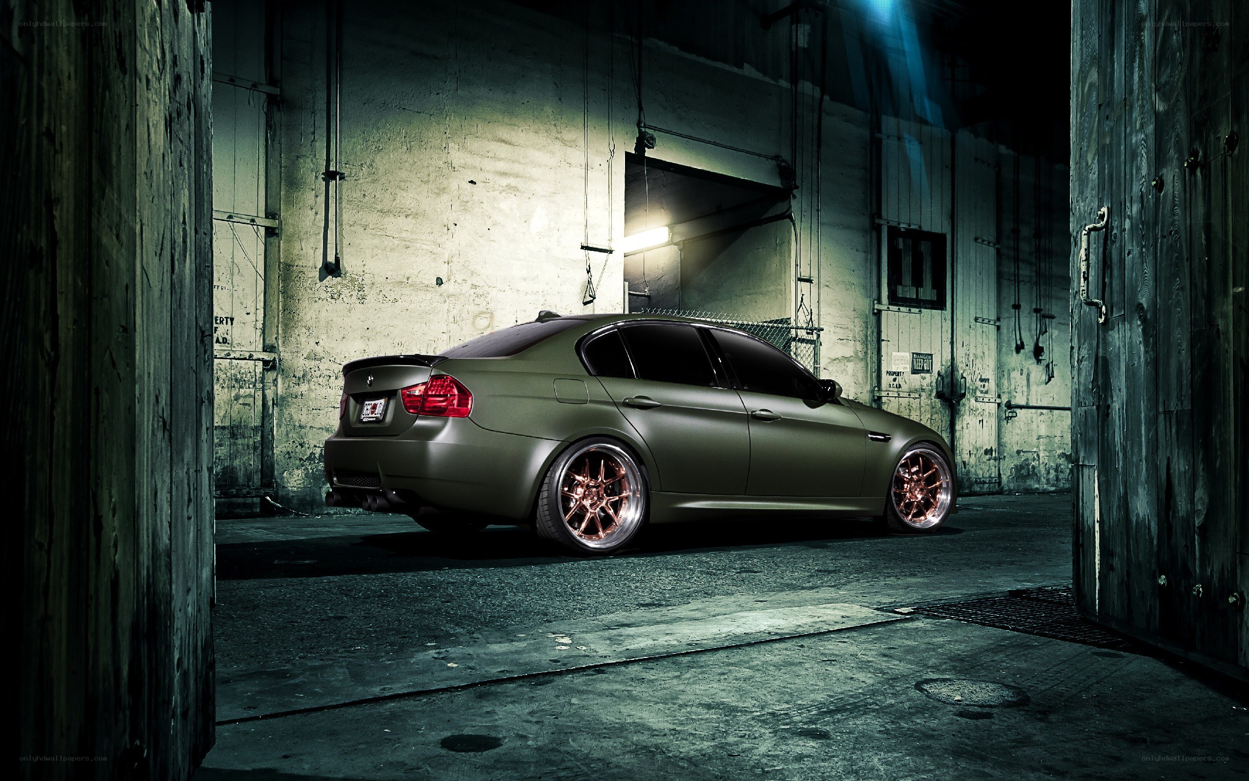 matte green car in warehouse