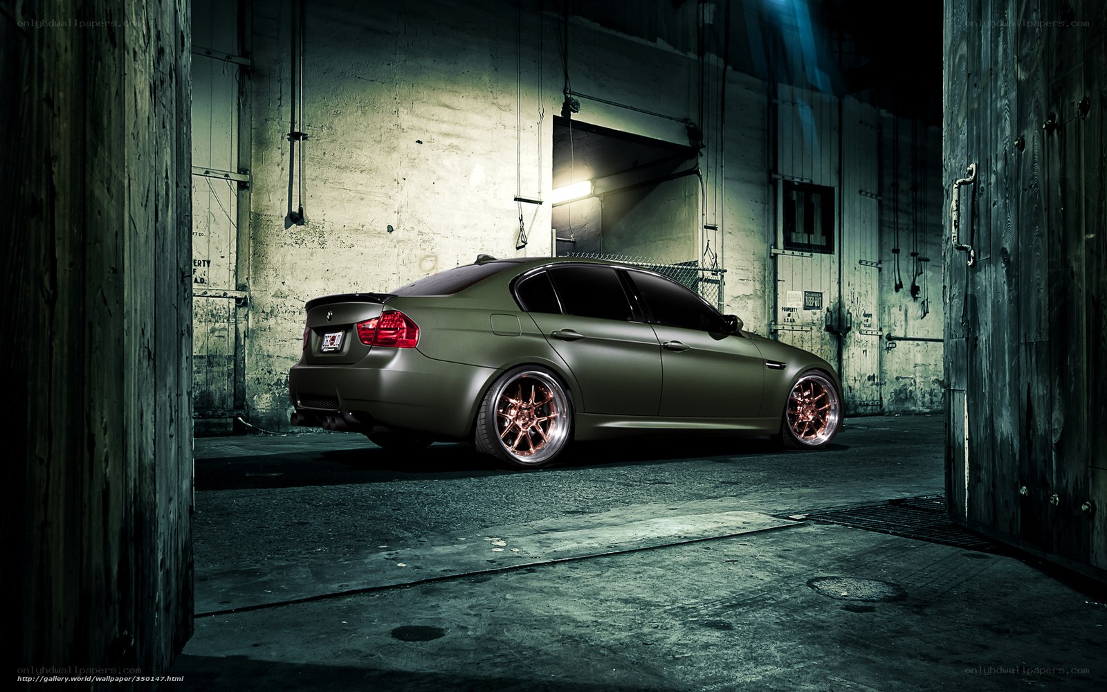 matte green car in warehouse