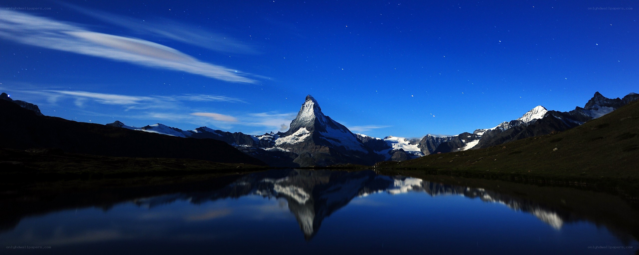 Matterhorn at night with lake reflection