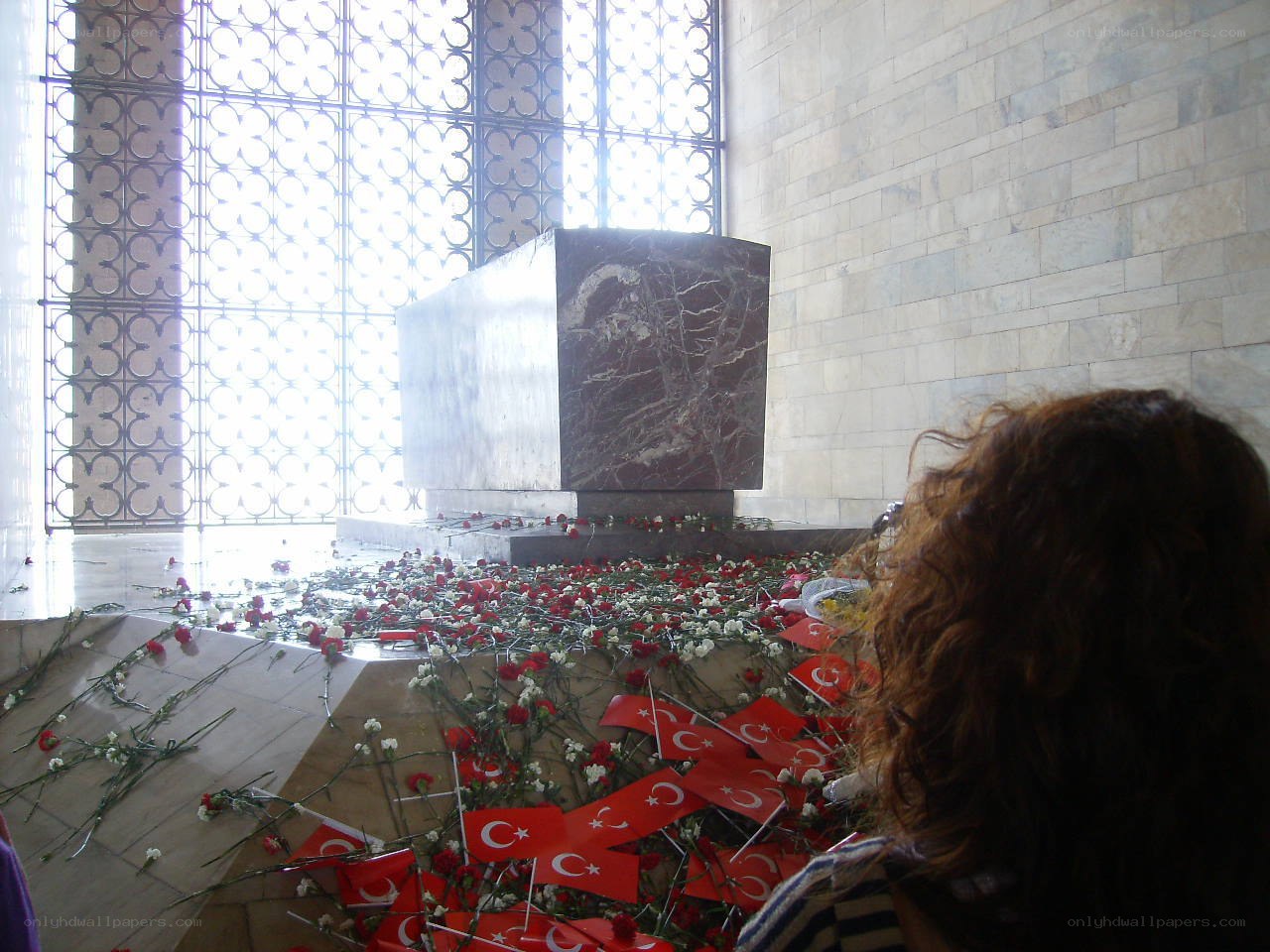 Mausoleum with flowers and flags