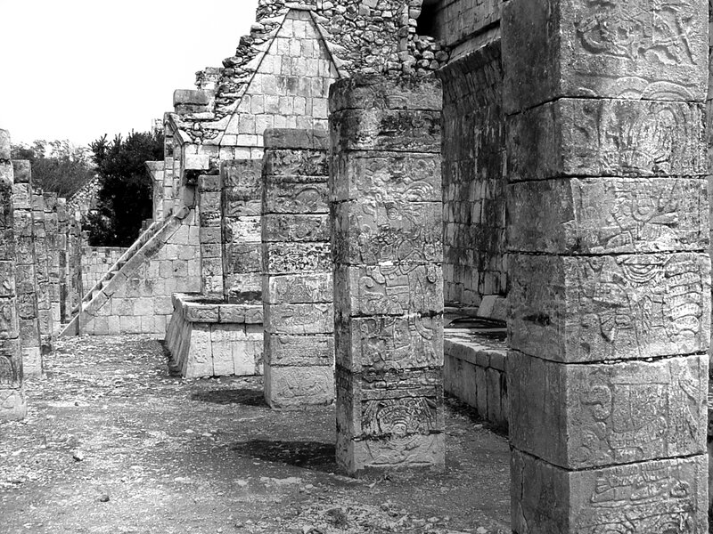 Mayan ruins with carved pillars