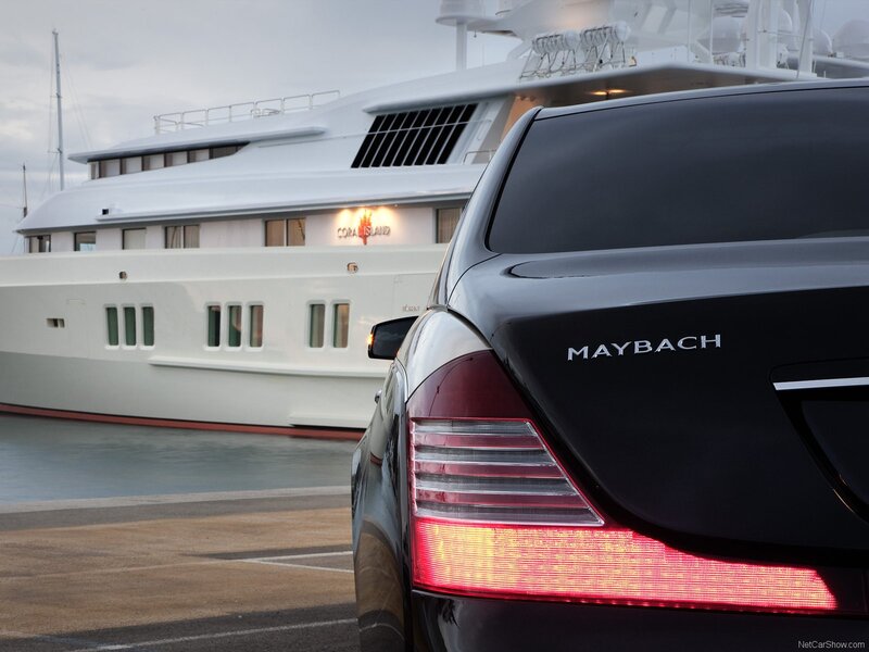 Maybach car near yacht