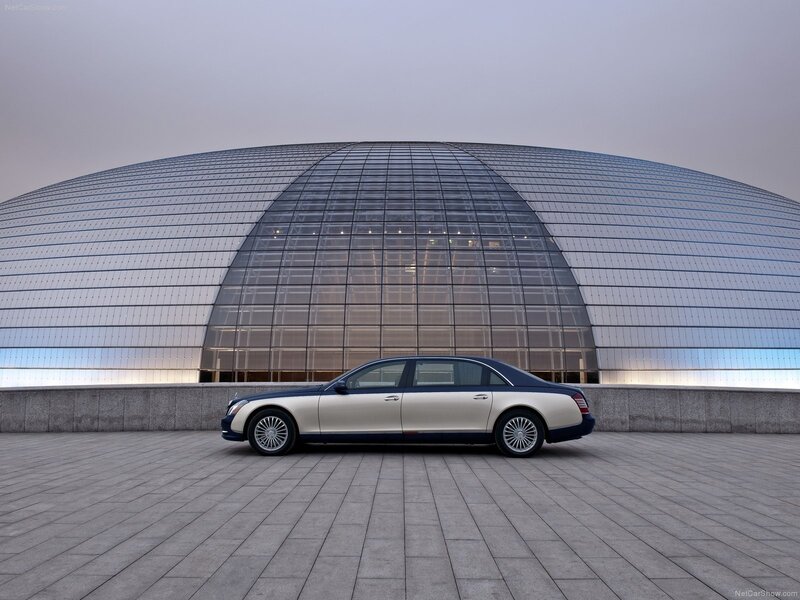 Maybach luxury sedan in front of modern building