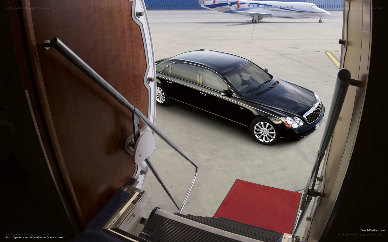 Maybach on tarmac with private jet