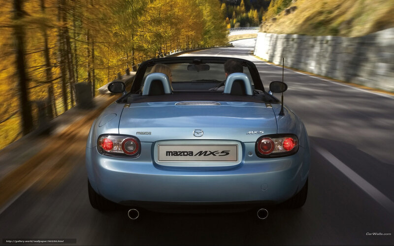 Mazda MX-5 driving on a scenic road