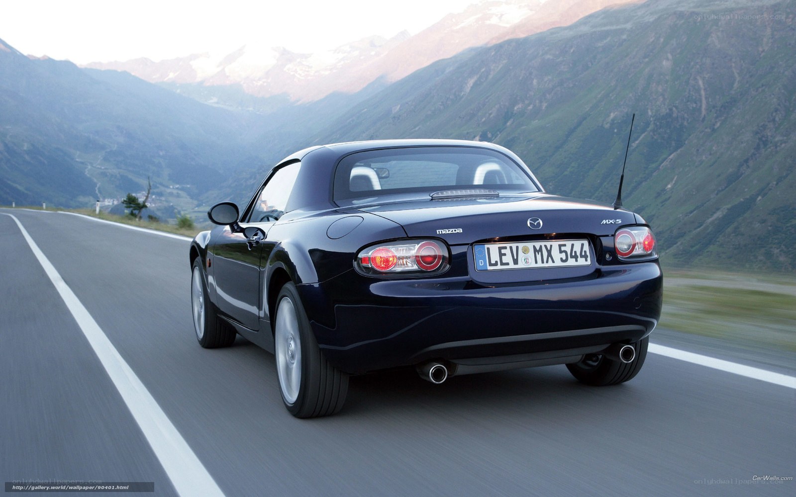 Mazda MX-5 driving on mountain road
