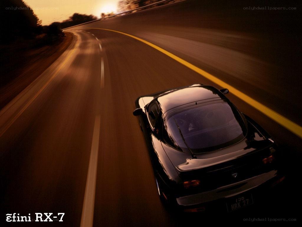 Mazda RX-7 on a winding road