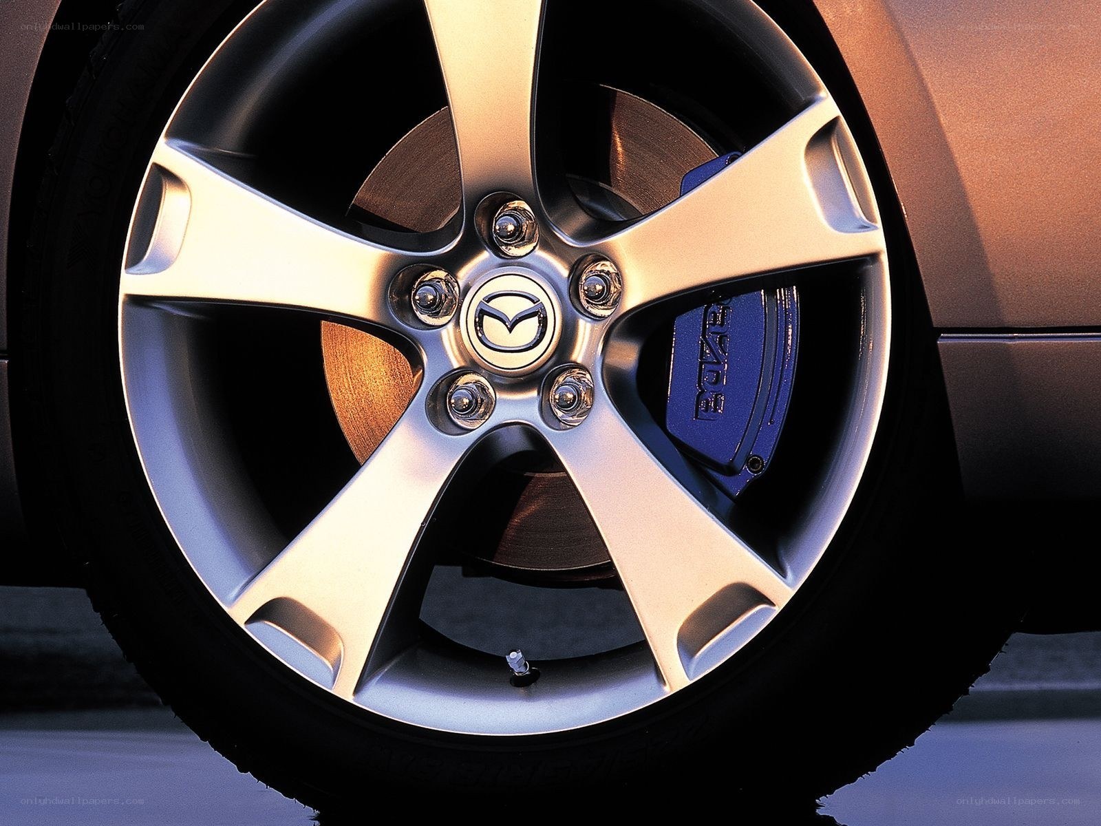 Mazda wheel with blue brake caliper