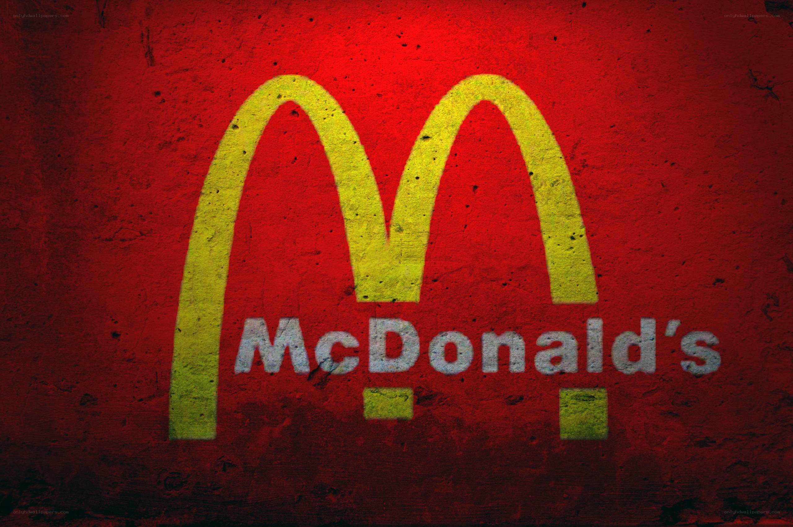 McDonald's logo on red wall