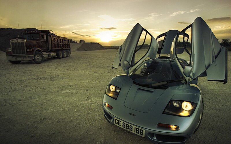 McLaren F1 at sunset with truck