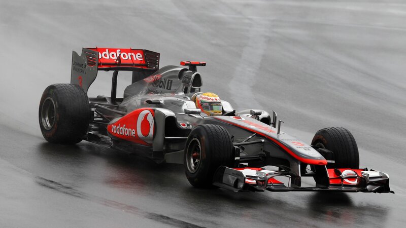 McLaren Formula 1 car on wet track
