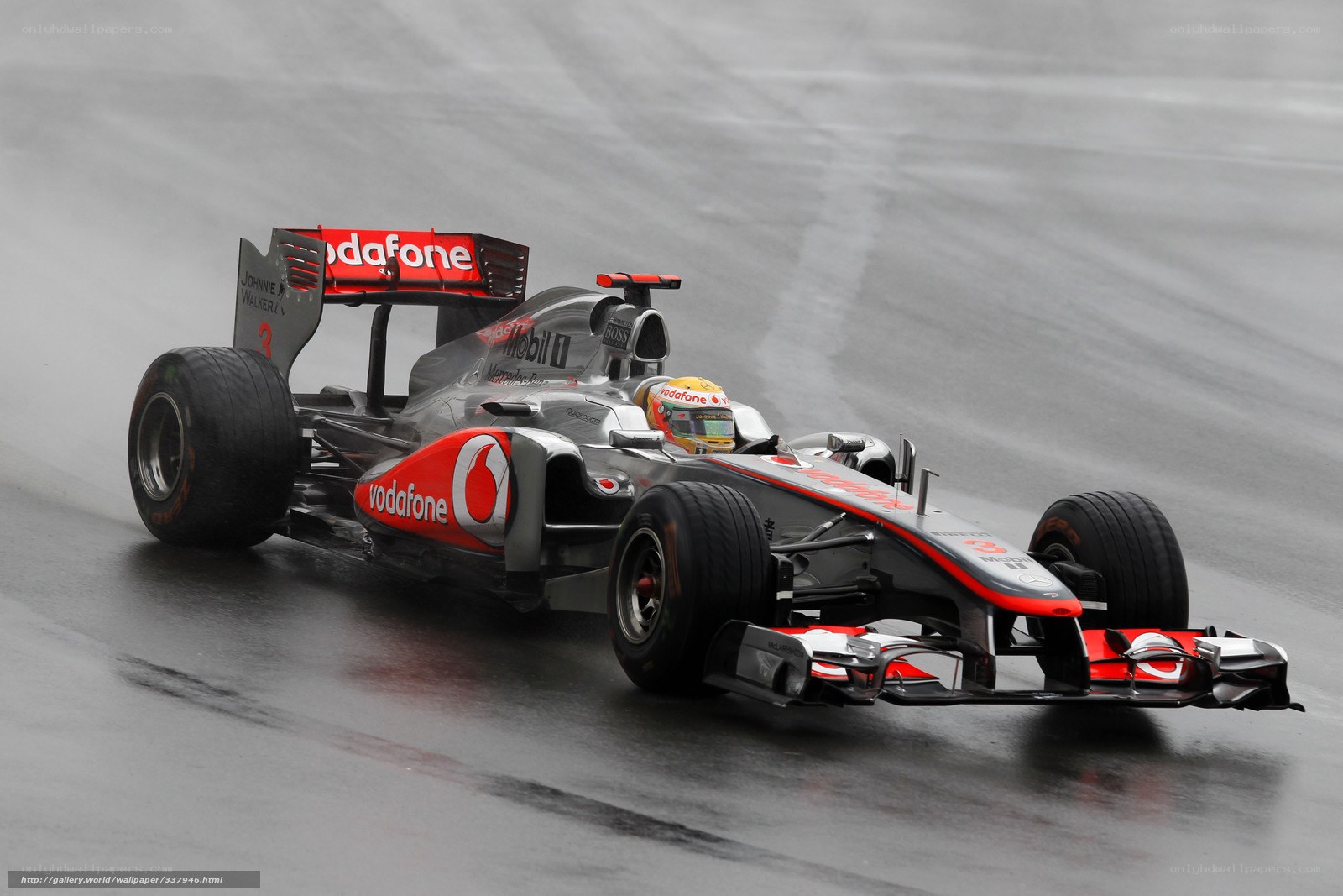 McLaren Formula 1 car on wet track