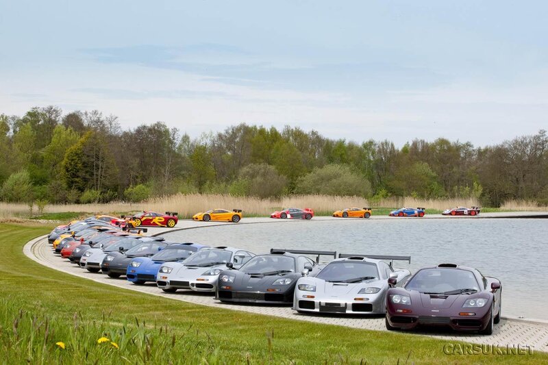 McLaren supercars by a lake