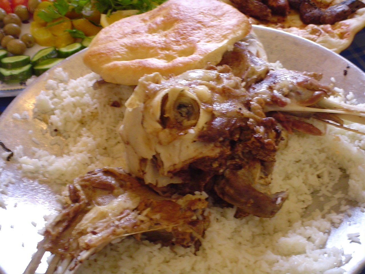 meat and rice dish with bread