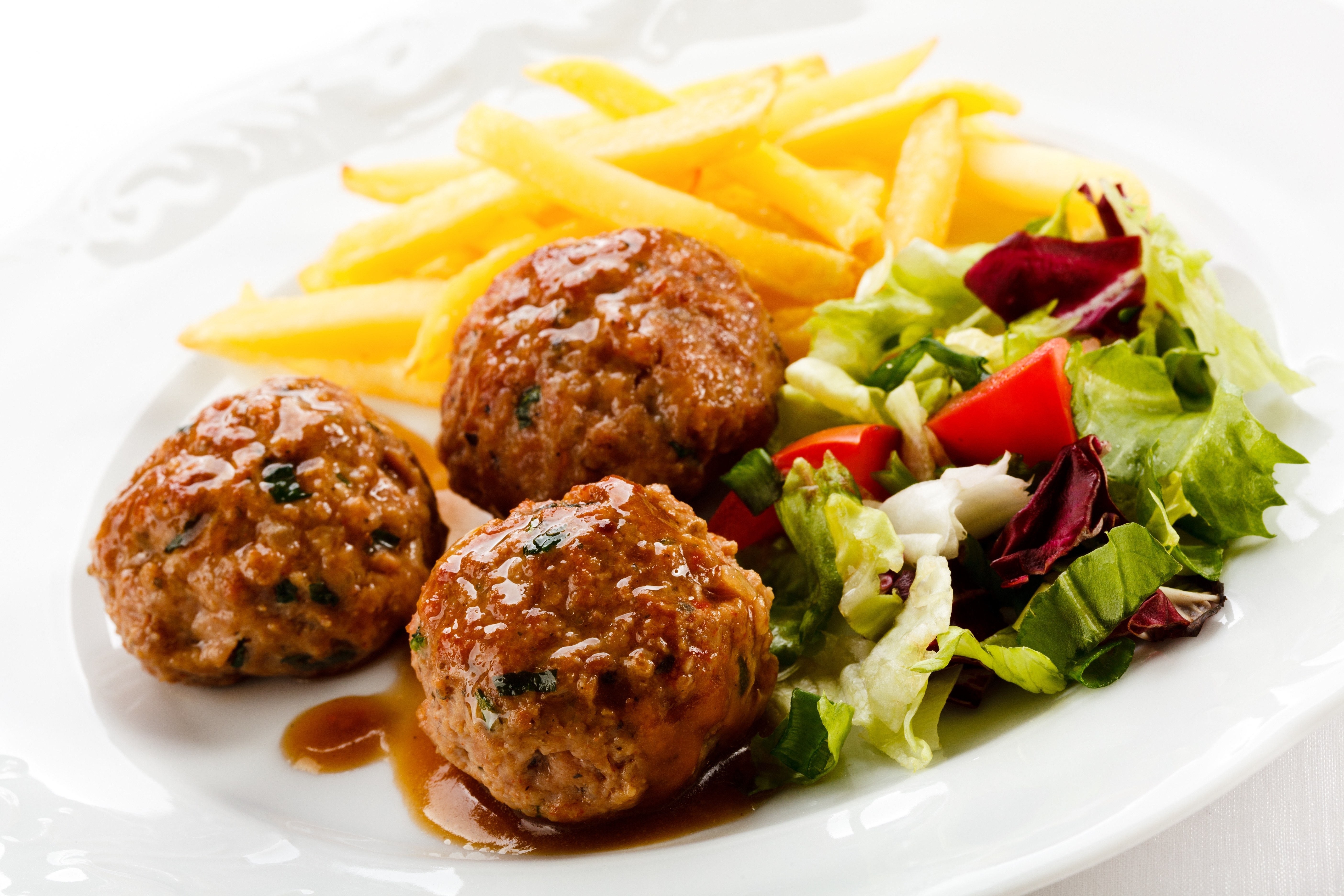 Meatballs with fries and salad