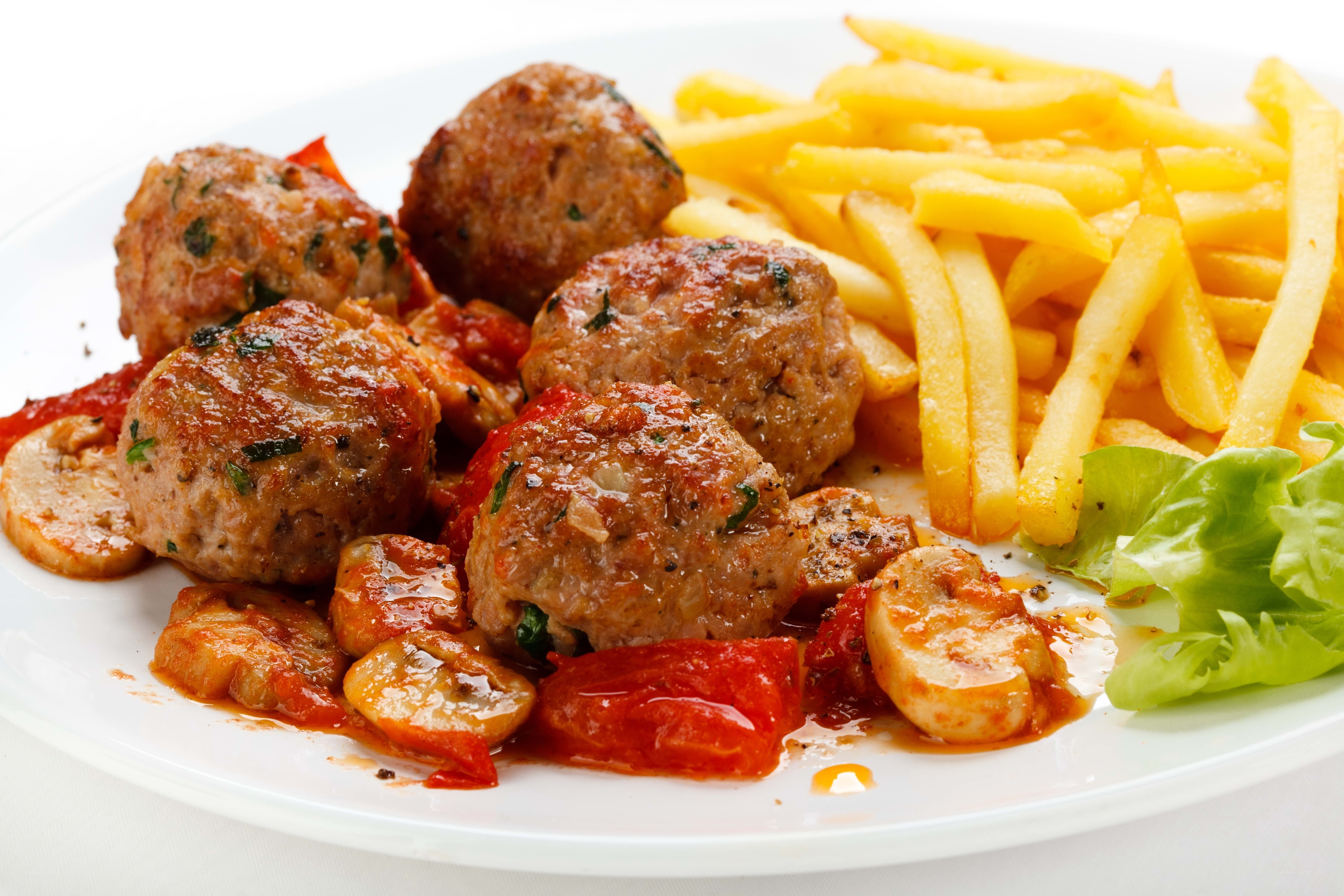 meatballs with fries and vegetables