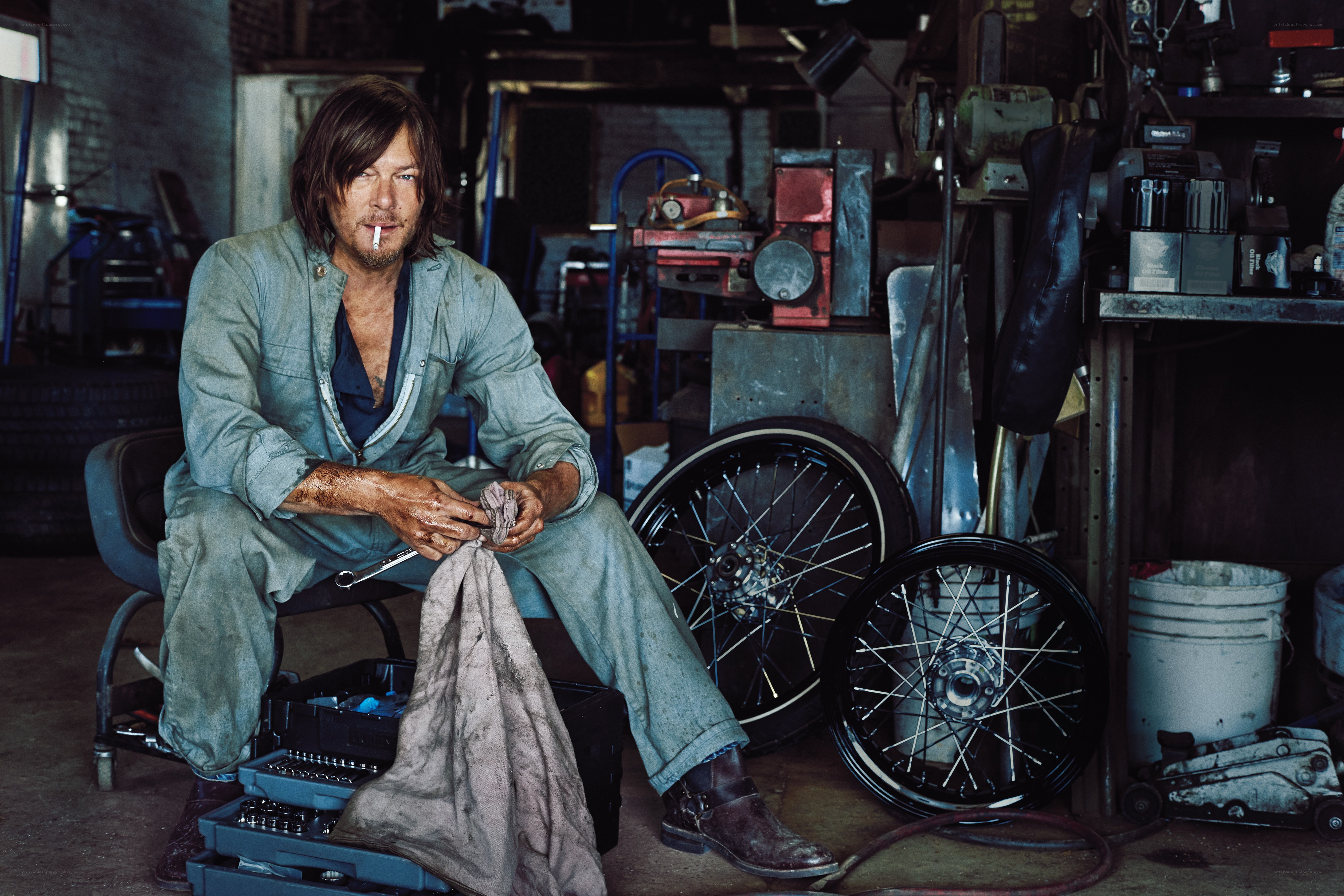 mechanic in workshop with cigarette